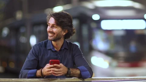 View of one young caucasian man with smartphone at night time Stock Footage 264179846