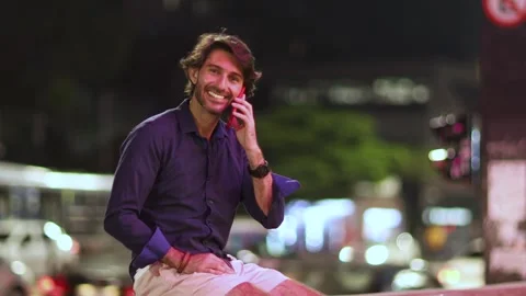 View of one young caucasian man with smartphone at night time Stock Footage 264181103