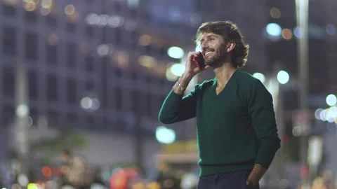 View of one young caucasian man with smartphone at night time Stock Footage 267706236