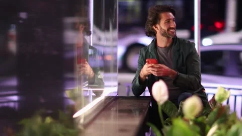 View of one young caucasian man with smartphone at night time Stock Footage 268812147