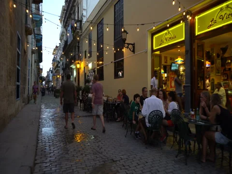View to open-air restaurant on streets of Havana in the evening Video stock 70991886
