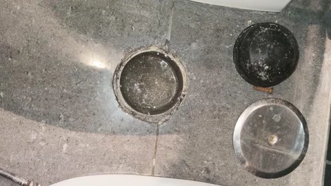 View of the open beam in the bathroom of the house. The plumber pushes the Video stock 164490341