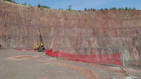 View in an open pit mine quarry. porphyry rocks. camera pan. 動画素材 63858628