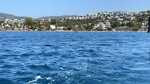 A view from the open sea towards Bitez marina in Bodrum, Turkey, with boats dock Stock Footage 346483132