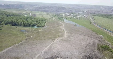 View of the open type coal enterprise. Train passing by rail Stock Footage 115326073