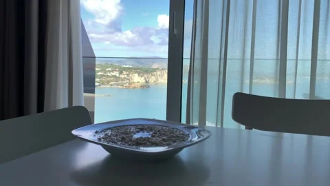 View from an open window with blue shutters of the sea, coastline, Greece. Video stock 302664583