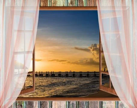 View from the open window of the caribbean sunset Stock Photos