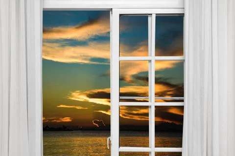 View from the open window of the caribbean sunset Foto stock