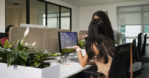 As view is opening, worker is pointing wind turbine display while colleague is Stock Footage 314028428