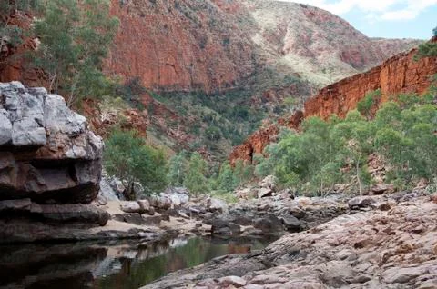 View of Ormiston Gorge with reflection in waterhole Stock Photos