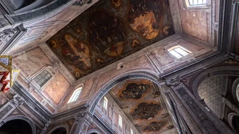 View of the ornate ceiling frescoes inside a historic church in Alberobello Video stock 326026459