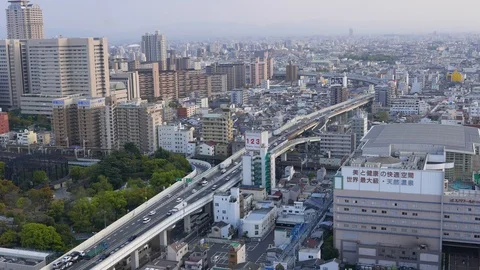 View on Osaka panorama, busy traffic on passway, driving cars and trucks pass by Stock Footage 90377554