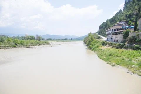 View of the Osum river flowing through the Albanian city of Berat. Stock Photos