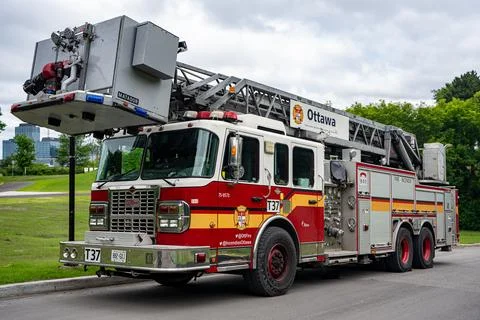 View of Ottawa Fire Services ladder fire truck parked outdoors. Ottawa, Canada - Stock Photos