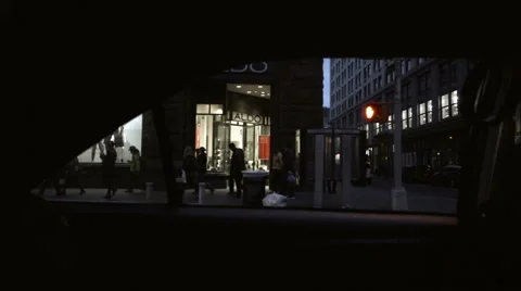 View out backseat passenger window driving down Broadway stores and graffiti NYC Stockbeeldmateriaal 58996717