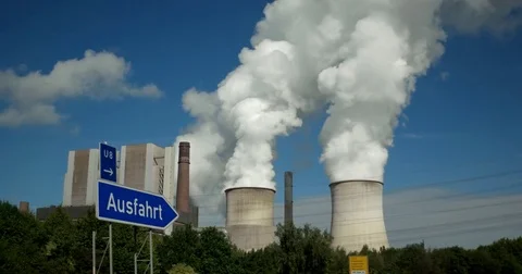 View out of car window passing by a cooling towers of nuclear power plant or Stock-Footage 84886797