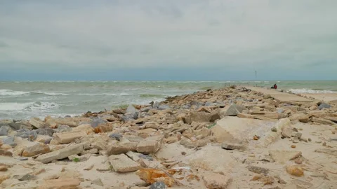 View out to the Gulf of Mexico over a pier at  Pass-a-Grille in St. Pete Beach,  Stock Footage 299921630
