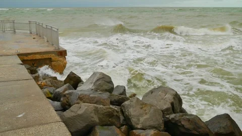 View out to the Gulf of Mexico over a pier at  Pass-a-Grille in St. Pete Beach,  Stock Footage 299921715