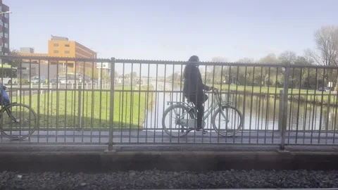 View Out Of Moving Train Crossing Road And Bridge Alkmaar Stock Footage 221991449
