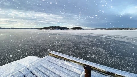 A view out over the ocean at the Swedish west coast. Animated snow. Stock Footage 325407251