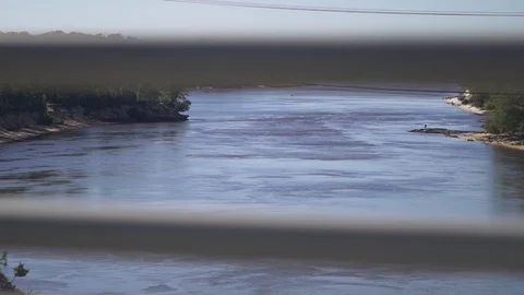 View out of passenger window driving over a bridge Stock Footage 98863831