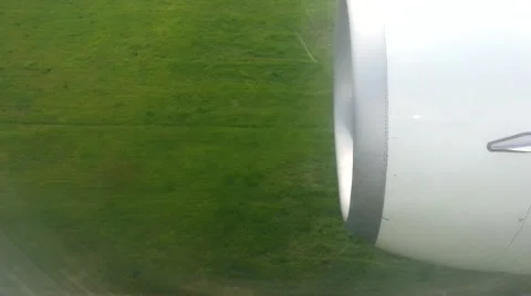 View out the window of an airplane as it lands at the airport. View of the landi Stock Footage 40257746