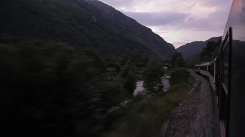 View out window of Europe night sleeper train, dusk falls, Pyrenees Stock Footage 70147311