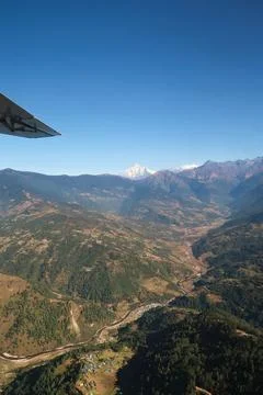 View out of the window on the flight from Lukla back to Kathmandu, villages a Stock Photos