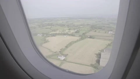 View out of window of plane while landing in Belfast Ireland Stock Footage 138022350