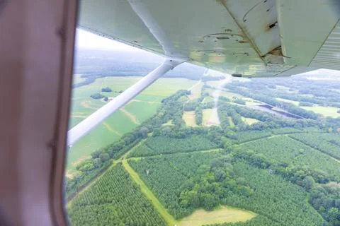 View out of the window of small airplane in flight Stock Photos