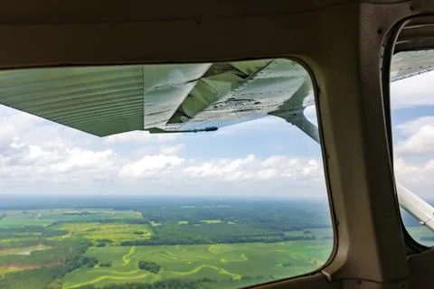 View out of the window of small airplane in flight Stock Photos