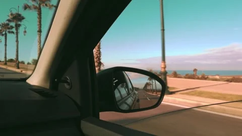 View of the outside environment from the car window through the side mirror. Video stock 303967447