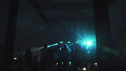View from outside of house with dancing people inside at night. Dancing Stock Footage 312768280