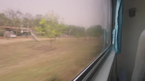 View outside the moving train traveling from Chiang Mai to Bangkok Stock Footage 240369541
