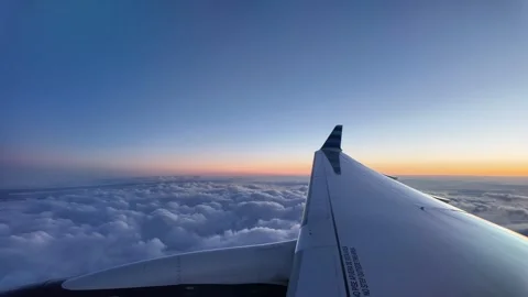 View outside the plane window above the clouds Stock Footage 319805975