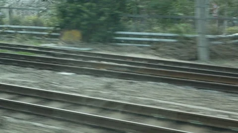 View outside train through train window while moving fast through city cent.. 스톡 동영상 317222721