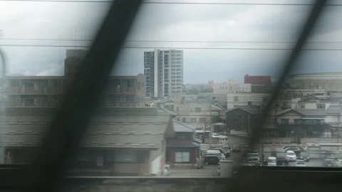 View outside train through train window while moving fast through residenti.. Stock Footage 318124426