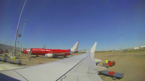 View outside window airplane unloading Stock Footage 37087436