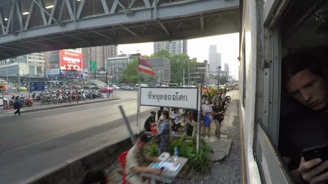 View Outside Window of Thai Train Driving Through Urban Bangkok, Thailand Stock Footage 127914233