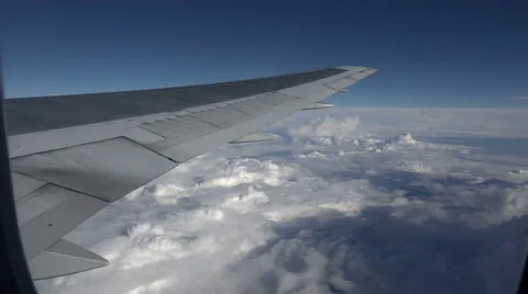 View over airplane wing to sky and clouds 스톡 동영상 45453629