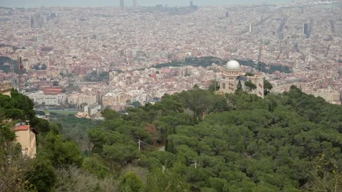 View over Barcelona with a observatory in the foreground - Slow Motion Stock Footage 173766889