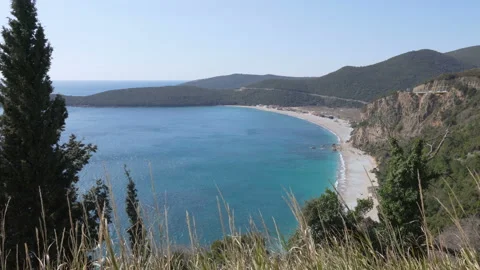 View over beach and lagoon Jaz towards beautiful green mountains on Montenegro Stock Footage 105378807