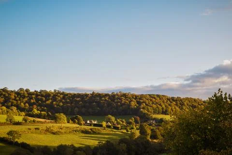 View over a beautiful valley with dramatic natural evening sunlight Stock Photos