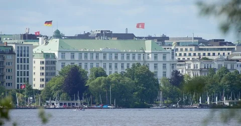 View over the Binnenalster towards an impressive deluxe hotel Video stock 76933744