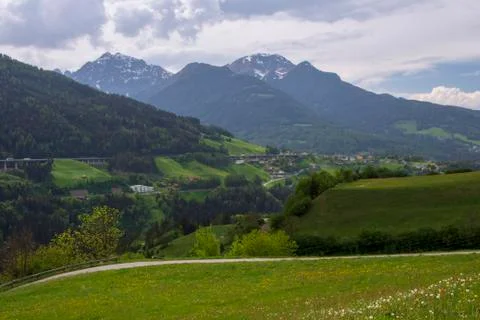 View over Brenner in spring time with  a meadow with flowers in forefront Stock Photos