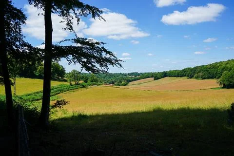 View over brown farm fields and countryside Stock Photos