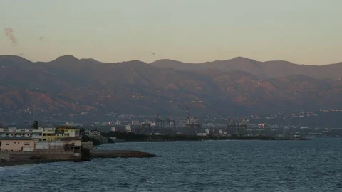 View over Cagway Bay towards Kingston and Blue Mountains, Portmore, Jamaica Stock Footage 139013372