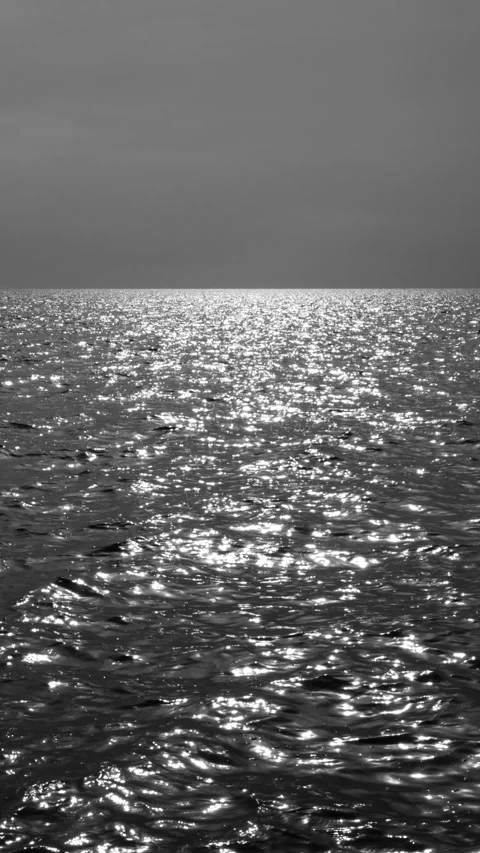 View over calm sea or ocean and sky with beautiful evening sun reflection Stock Footage 161275892