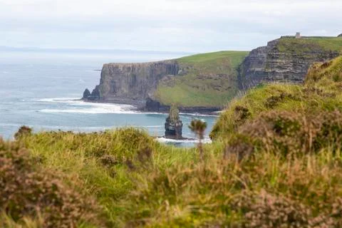 View over cliff line of the Cliffs of Moher in Ireland during daytime Stock Photos