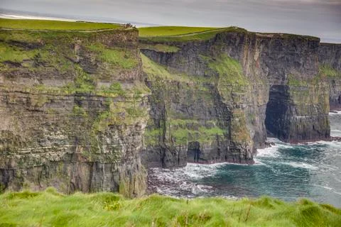 View over cliff line of the Cliffs of Moher in Ireland during daytime Stock Photos